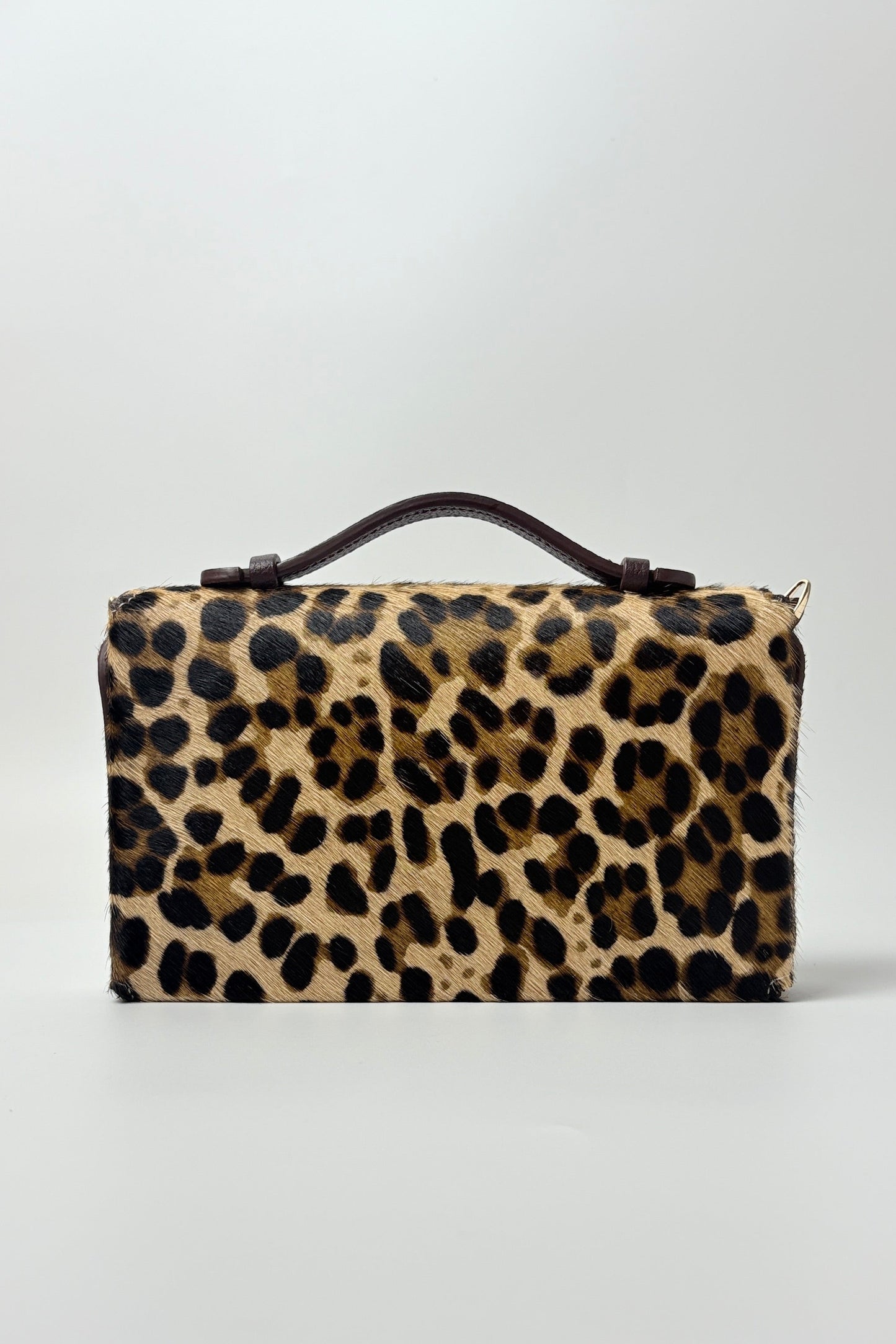 Leopard print handbag on a white background