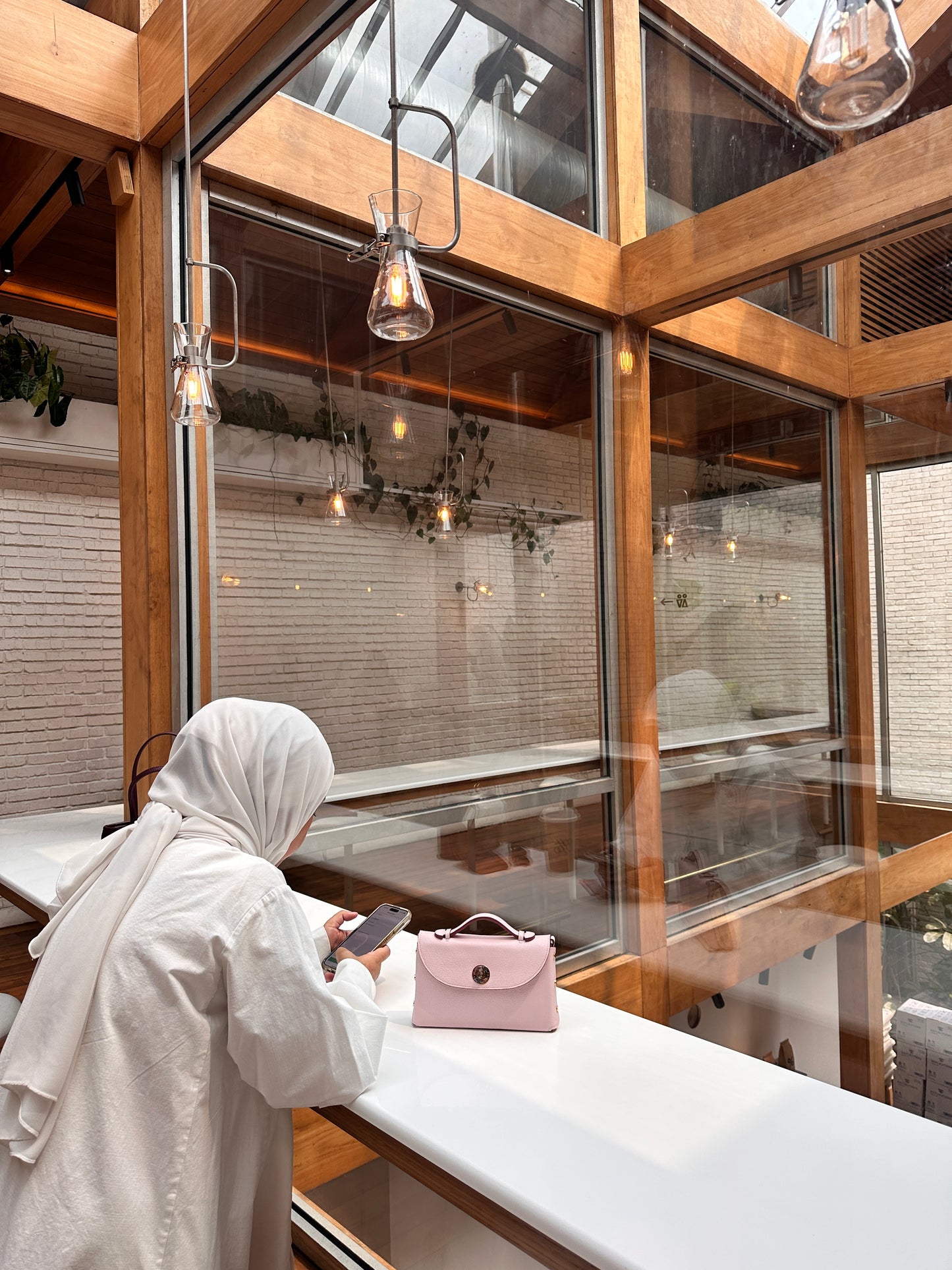 Sumi Crossbody Bag in Pale Pink with Abalone Lock