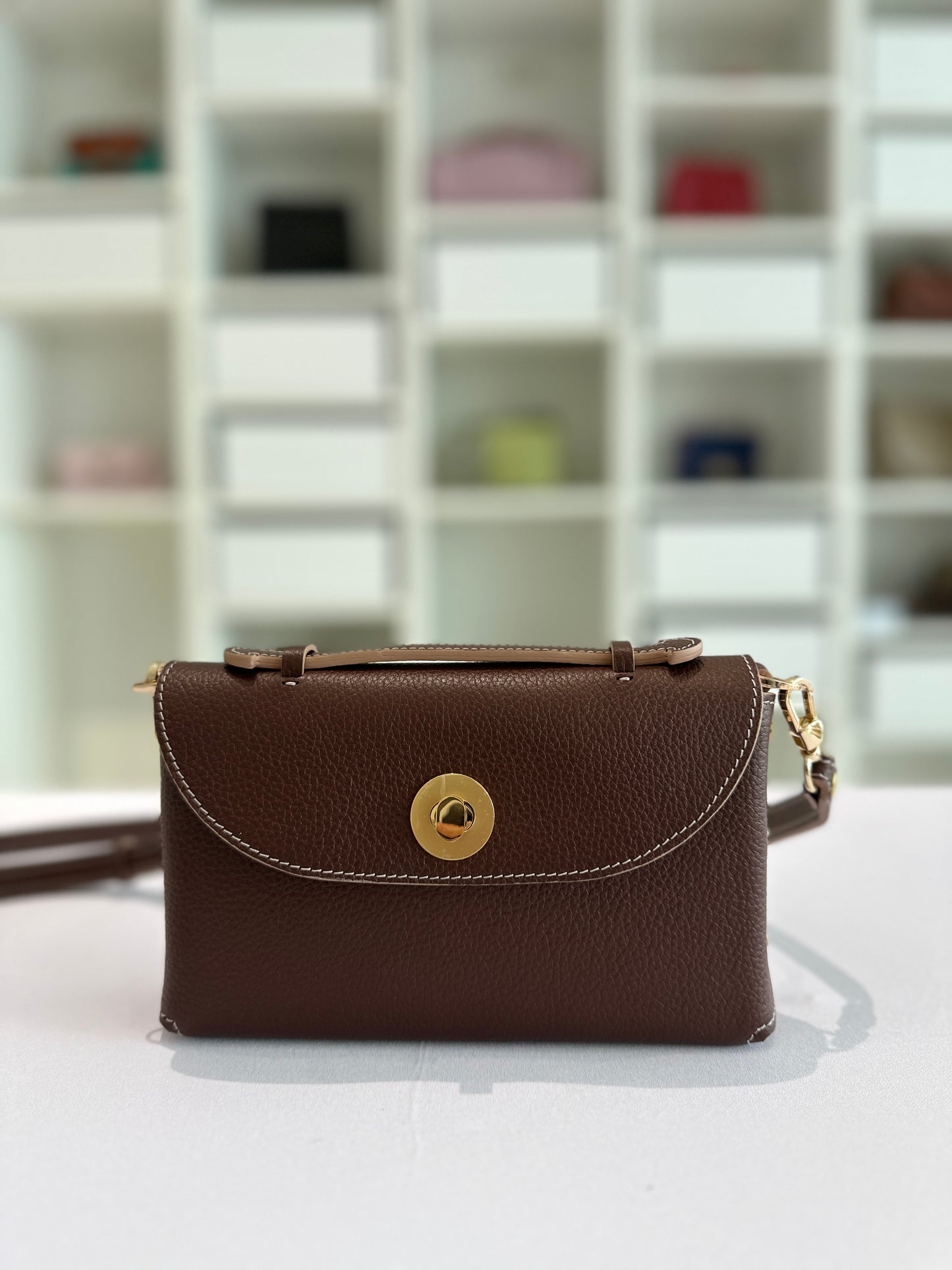 Sumi Crossbody Clutch Bag in Palisander with Gold Lock (with beige edge)