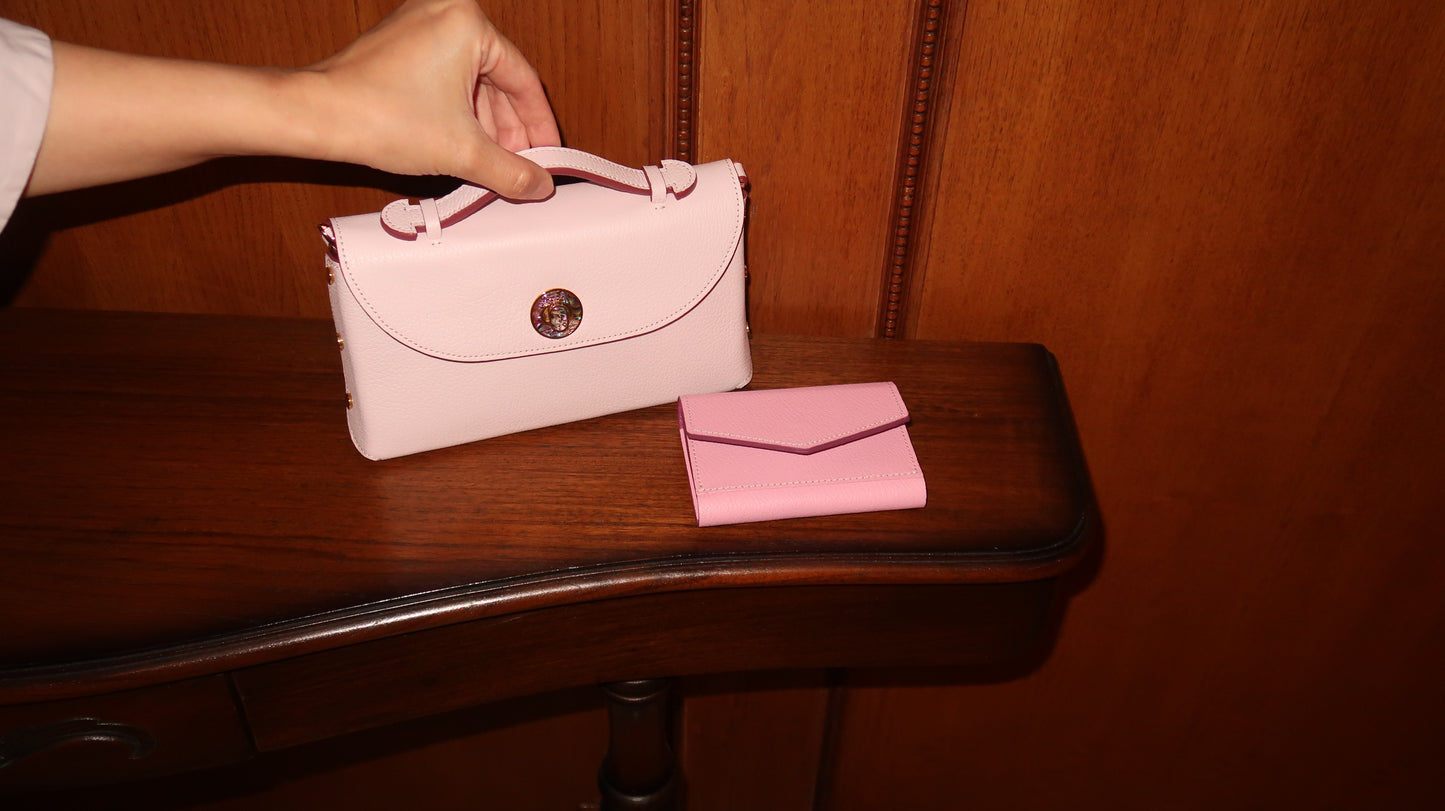 Sumi Crossbody Bag in Pale Pink with Abalone Lock