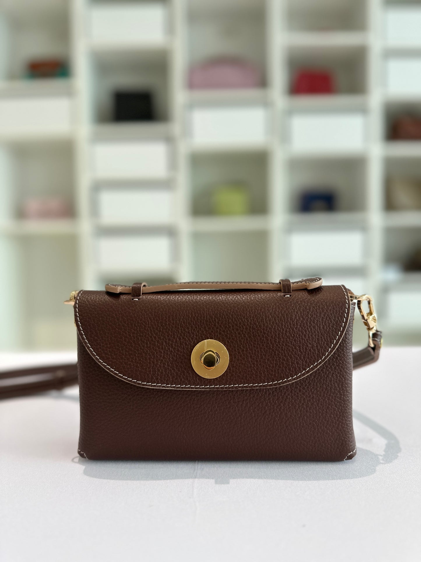 Sumi Crossbody Clutch Bag in Palisander with Gold Lock (with beige edge)