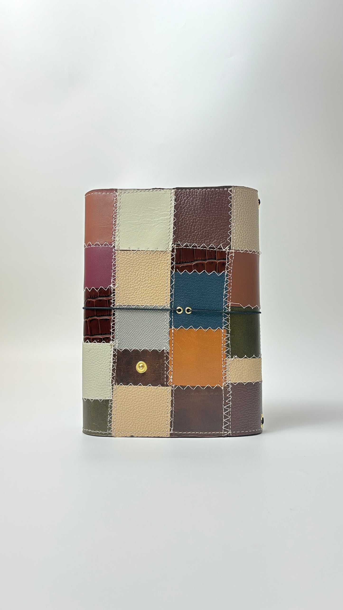 Patchwork wallet with multicolored squares on a white background