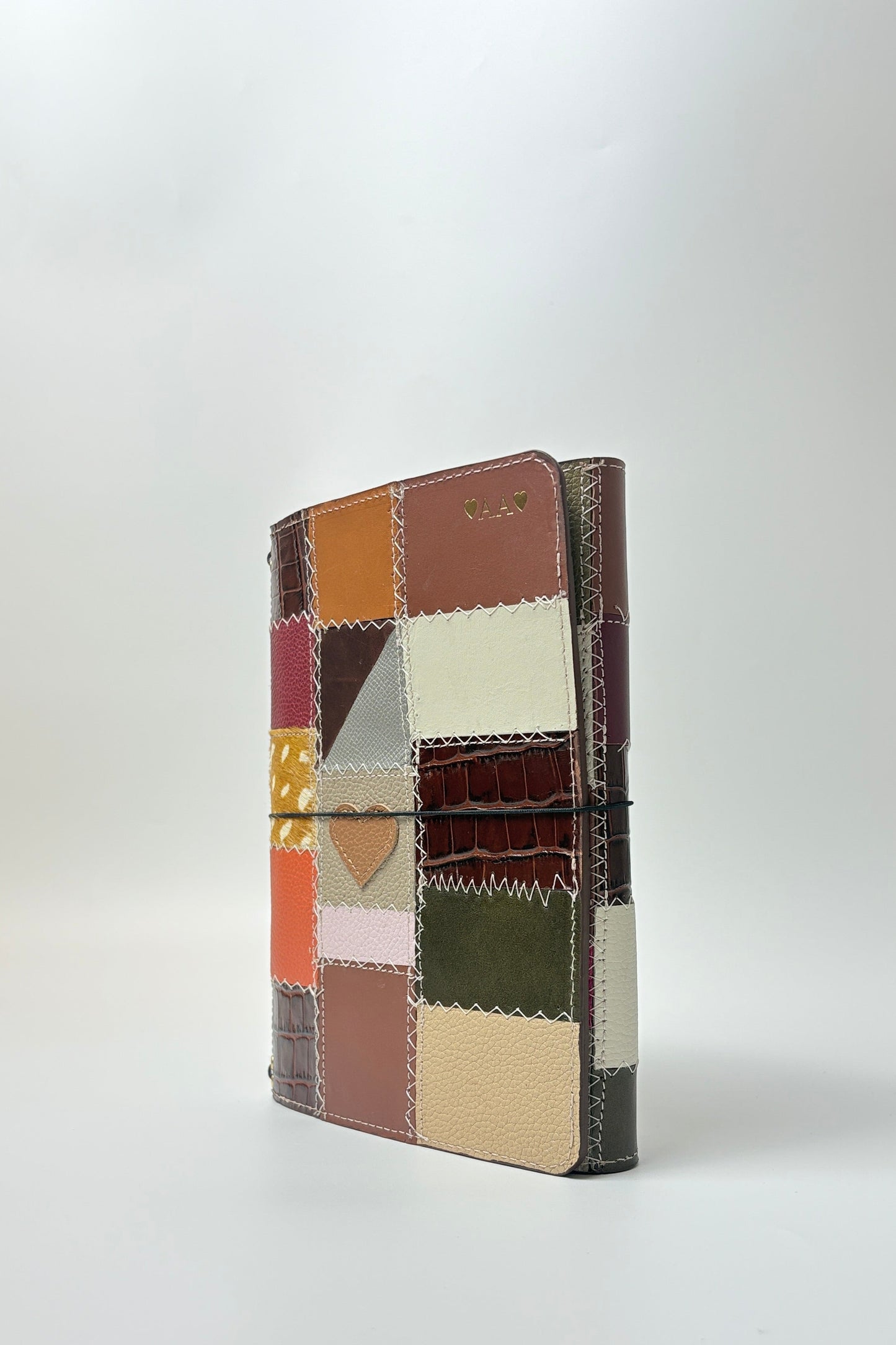 Patchwork notebook with multicolor pattern on a white background