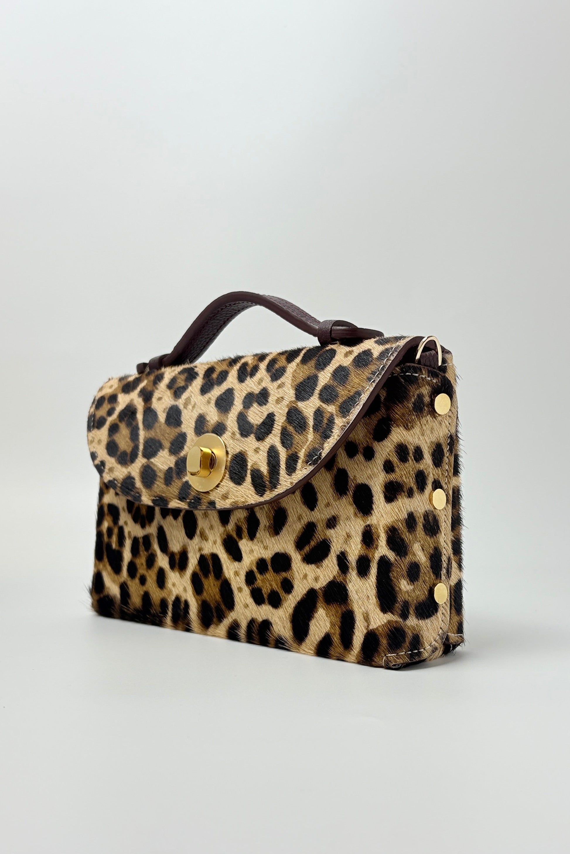 Leopard print handbag on a light gray background