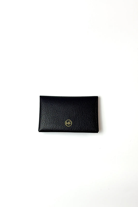 Black the plier leather cardholder with gold logo on a white background