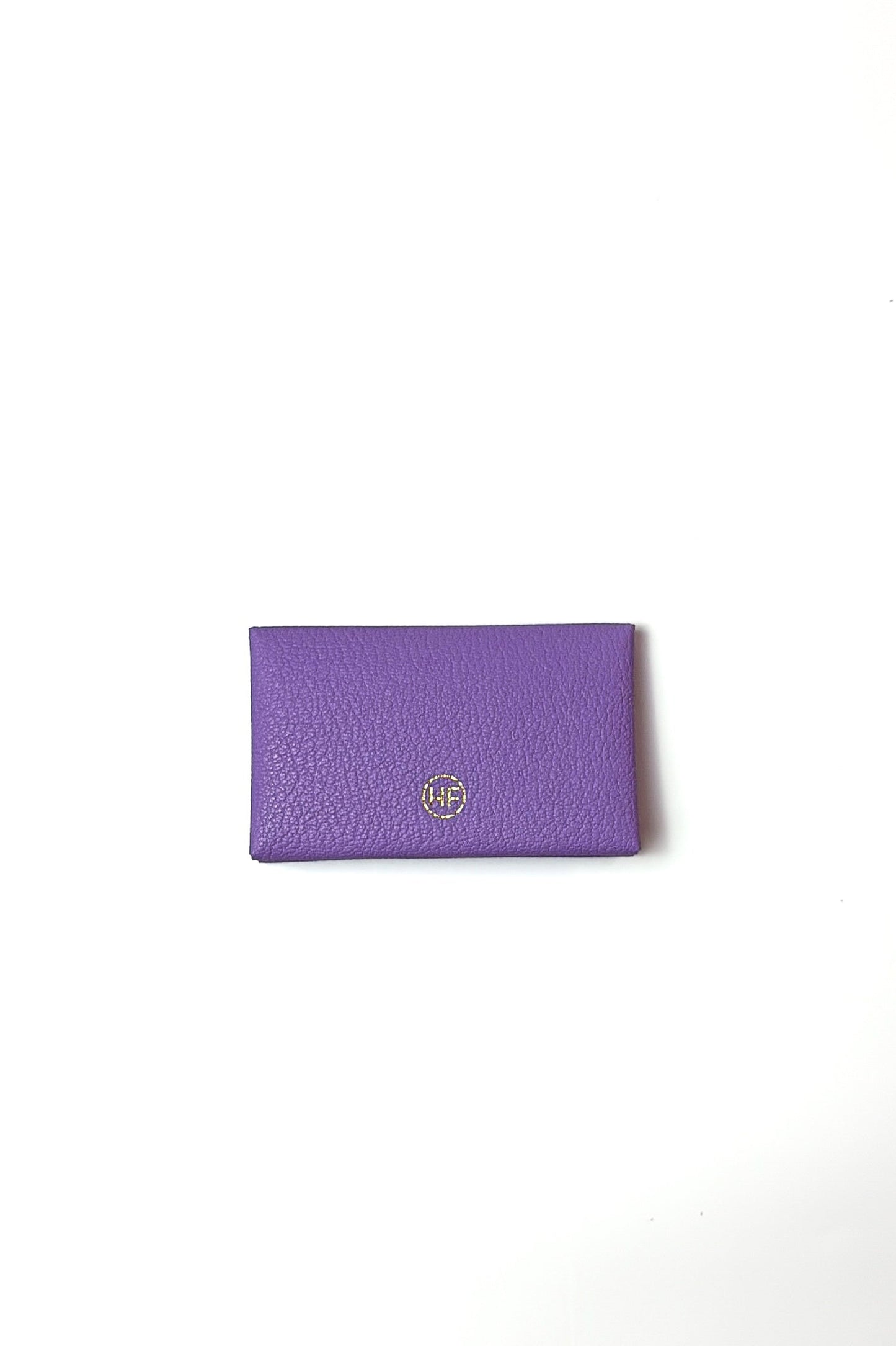 Purple wallet with a brand logo on a white background