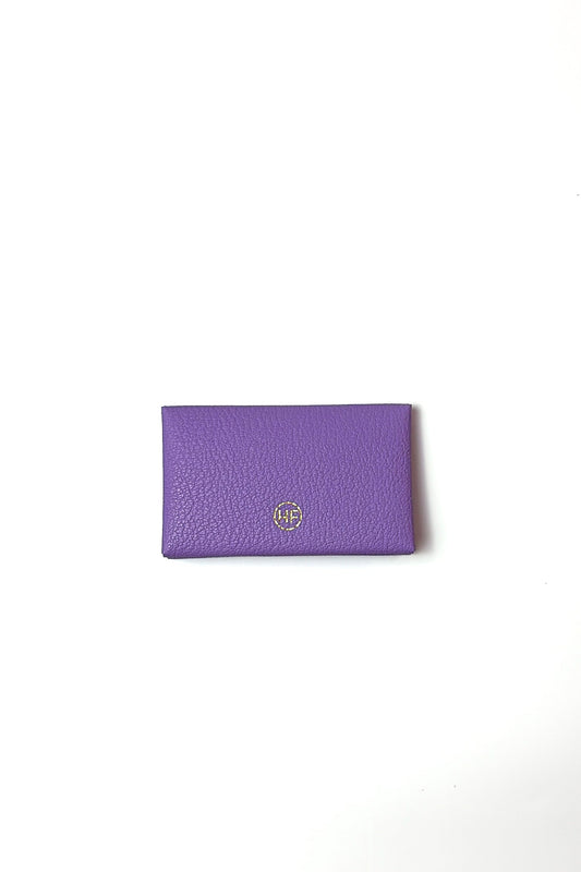 Purple wallet with a brand logo on a white background