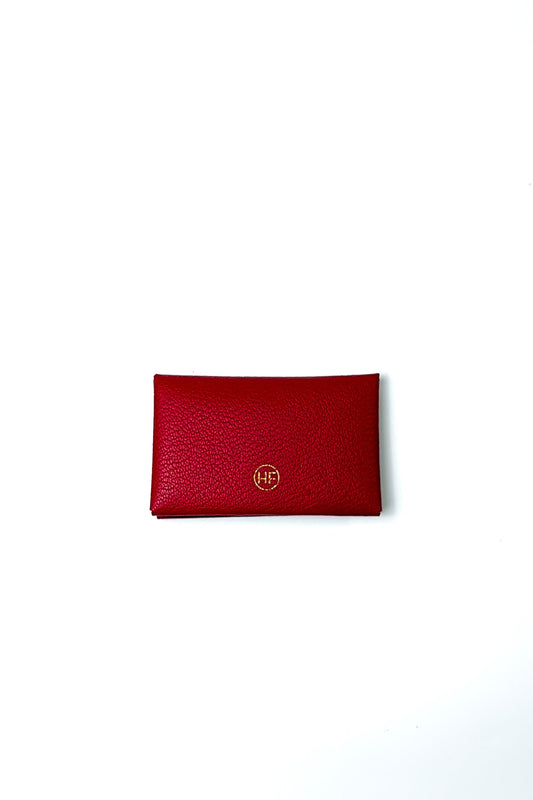 Red wallet with a brand logo on a white background