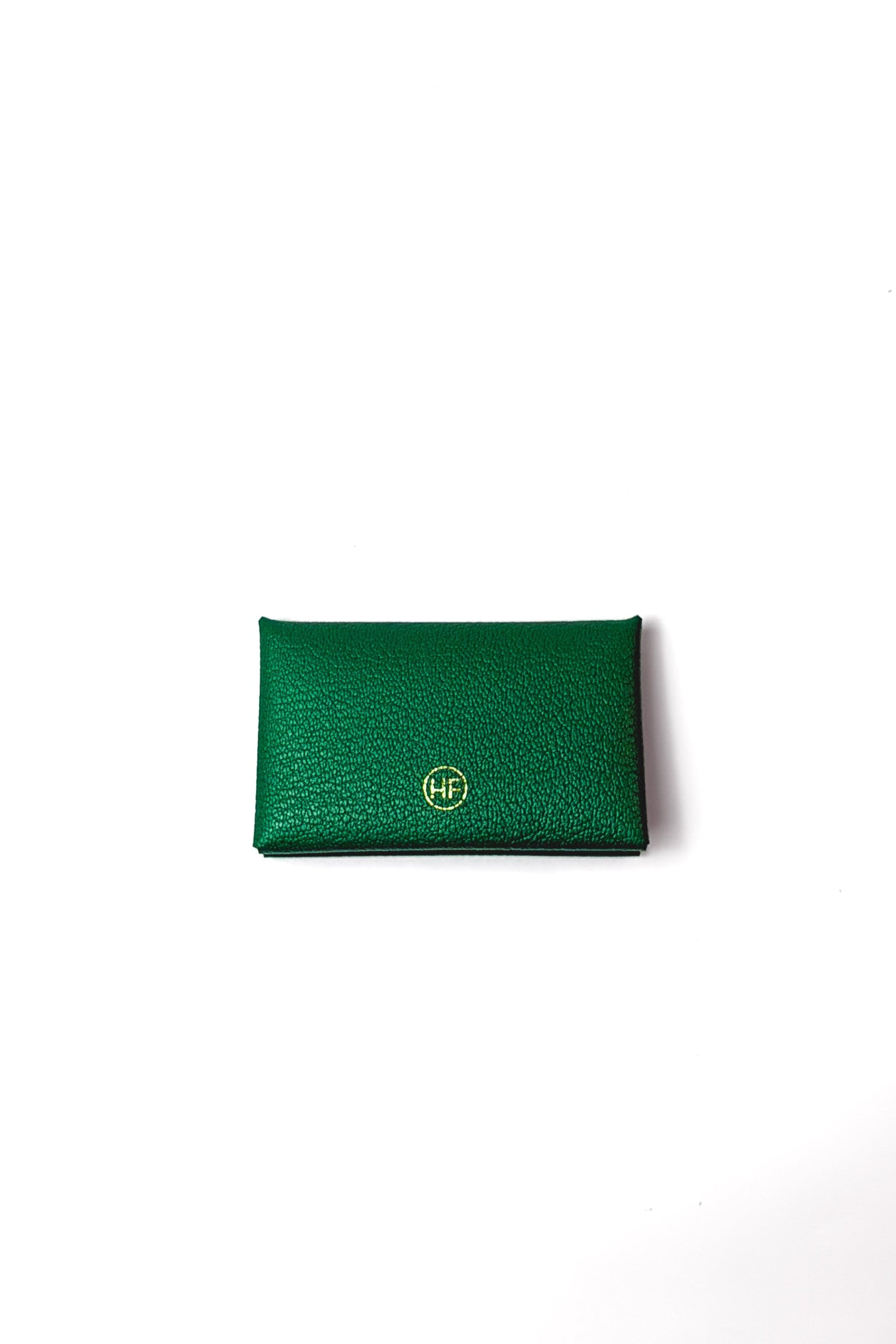 Green wallet with a logo on a white background