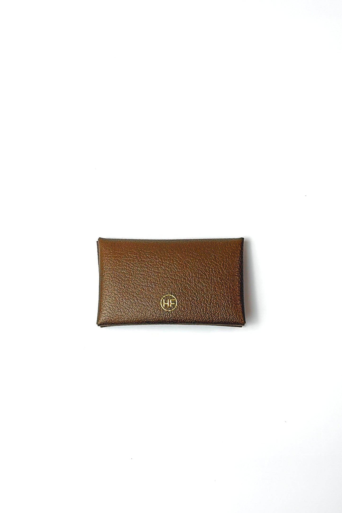 Brown leather wallet with a gold emblem on a white background